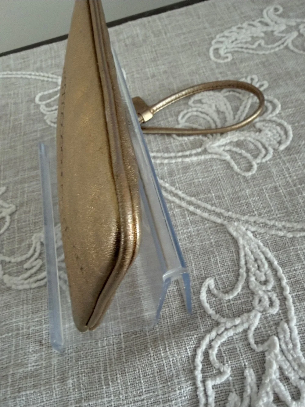 Coach Metallic Gold Wristlet with Embossed Chain Motif
